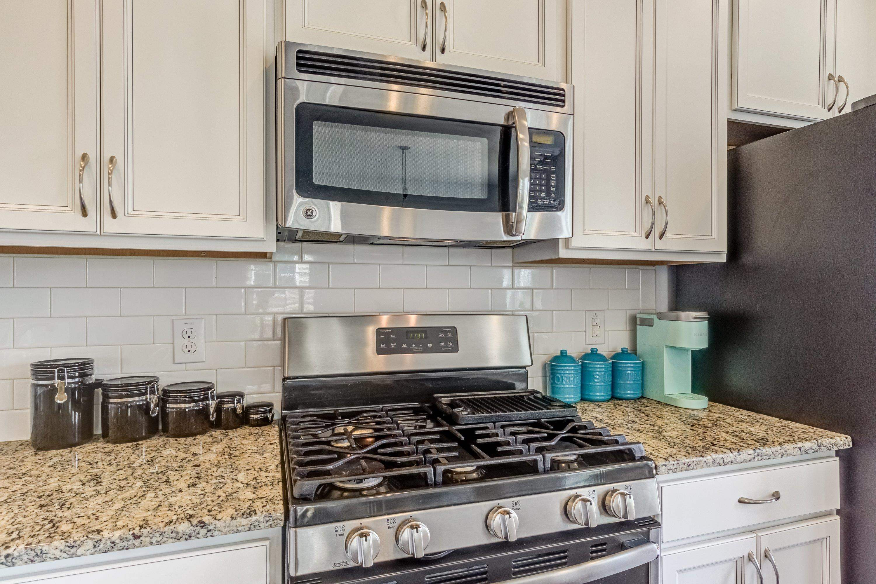 411 Provincial Street Raleigh, NC 27603 - Photo 13 of 41 a kitchen with granite countertop stainless steel appliances and cabinets