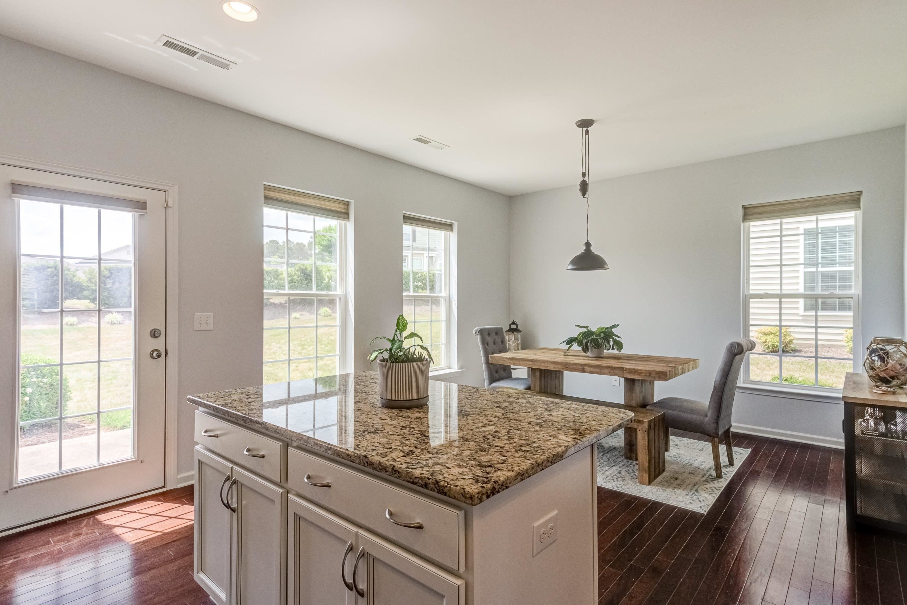 411 Provincial Street Raleigh, NC 27603 - Photo 16 of 41 a view of a kitchen wooden floor and a living room
