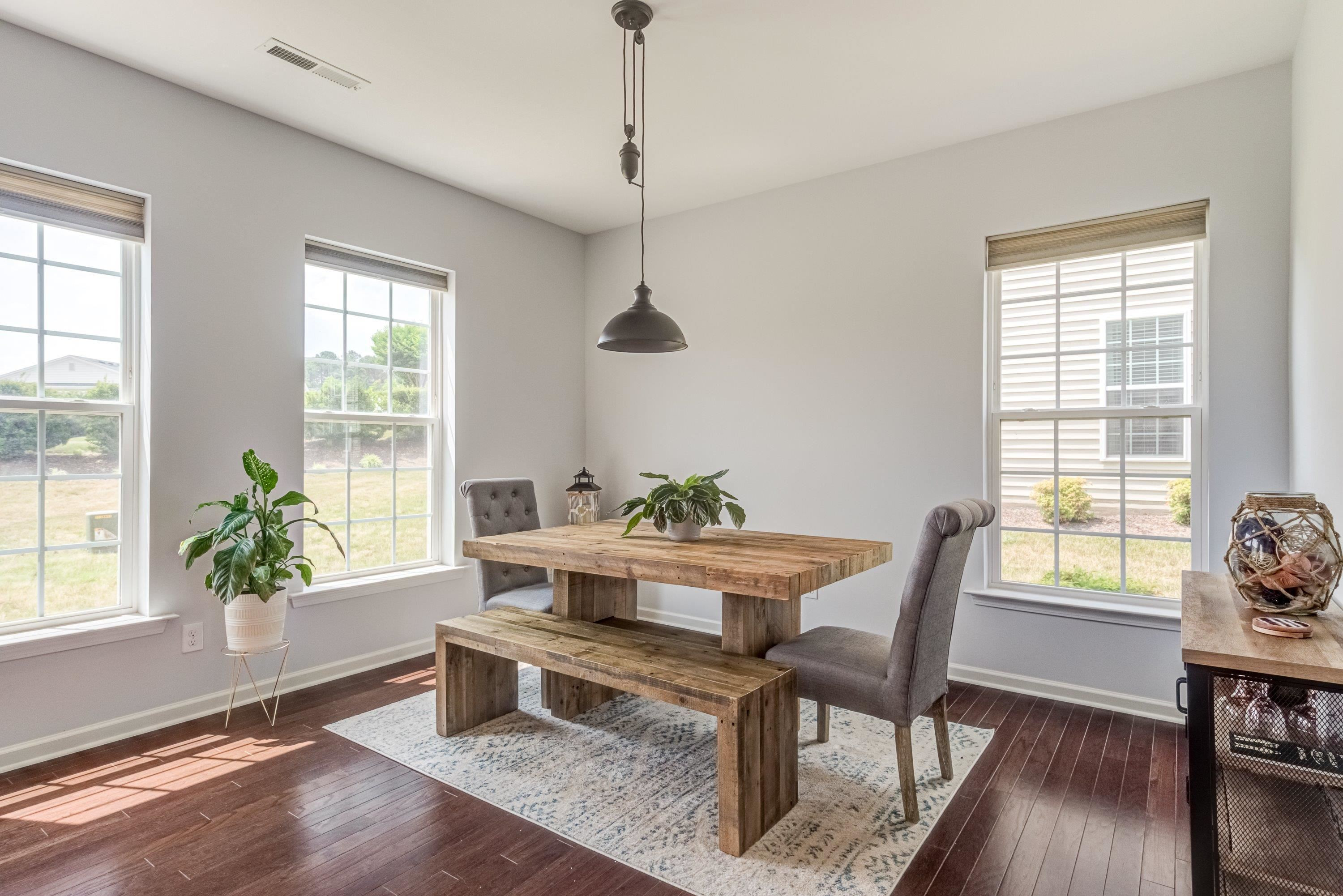 411 Provincial Street Raleigh, NC 27603 - Photo 17 of 41 a workspace with furniture window and wooden floor