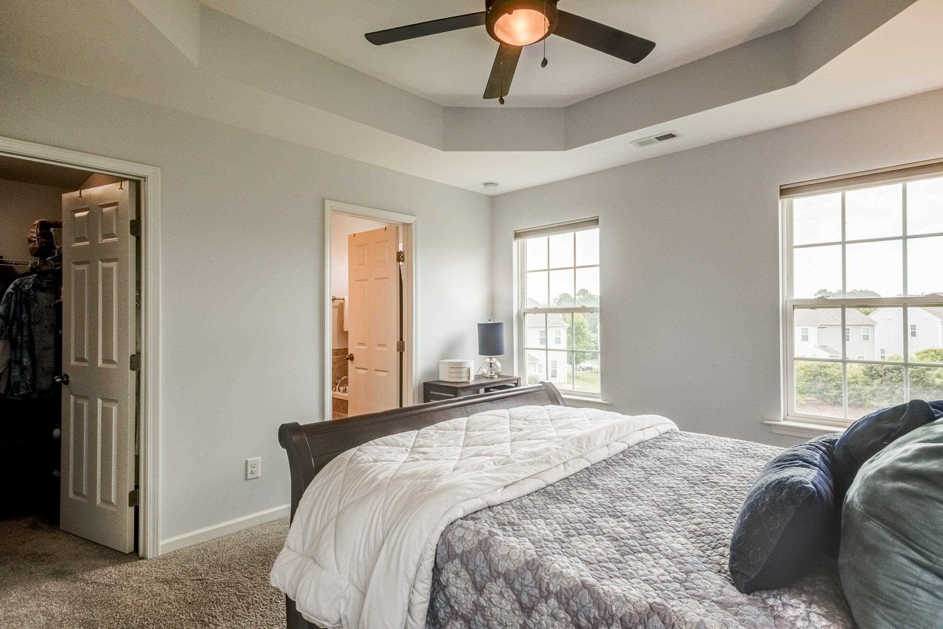 411 Provincial Street Raleigh, NC 27603 - Photo 20 of 41 a bedroom with a large bed and a window
