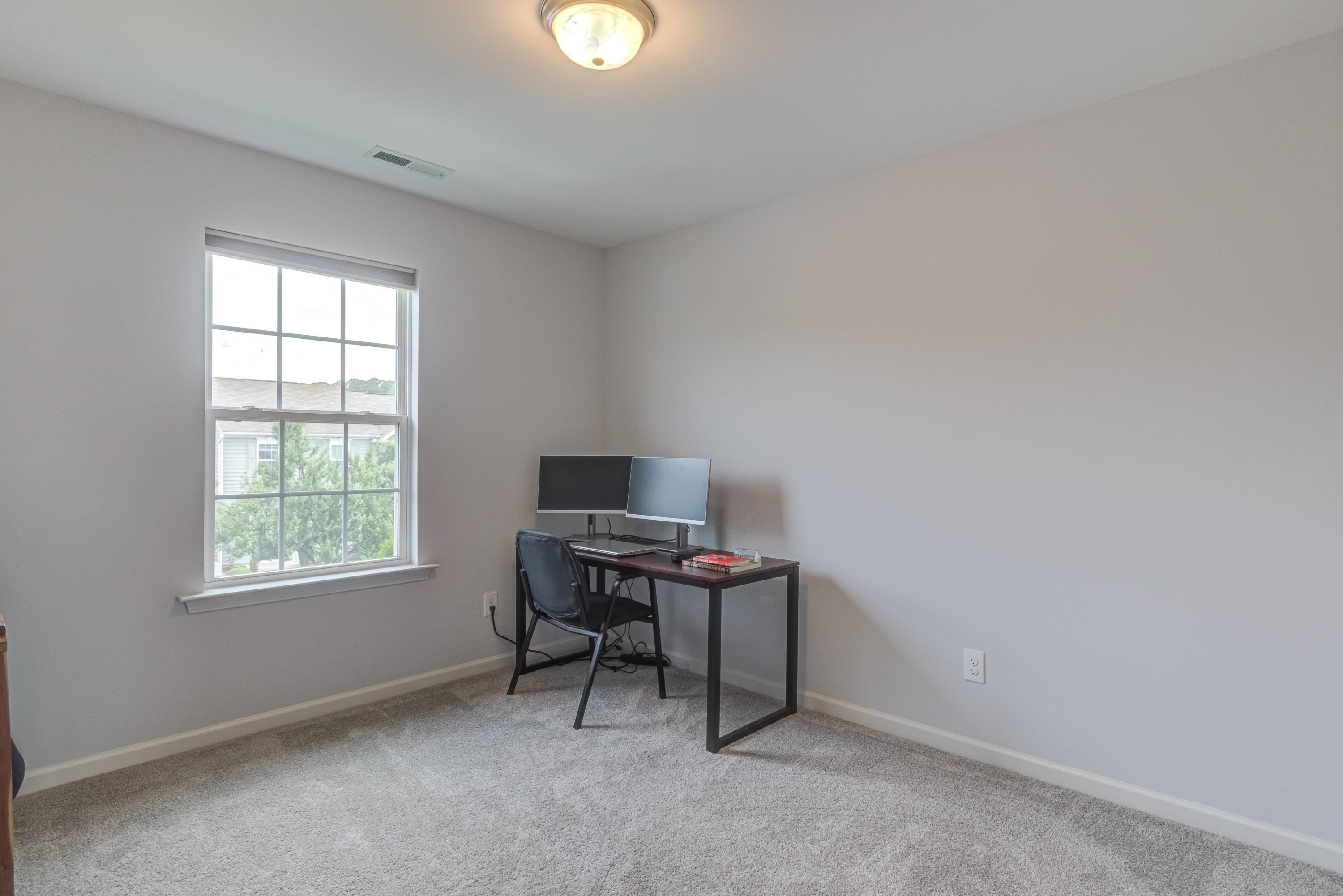 411 Provincial Street Raleigh, NC 27603 - Photo 26 of 41 a workspace with furniture and a window