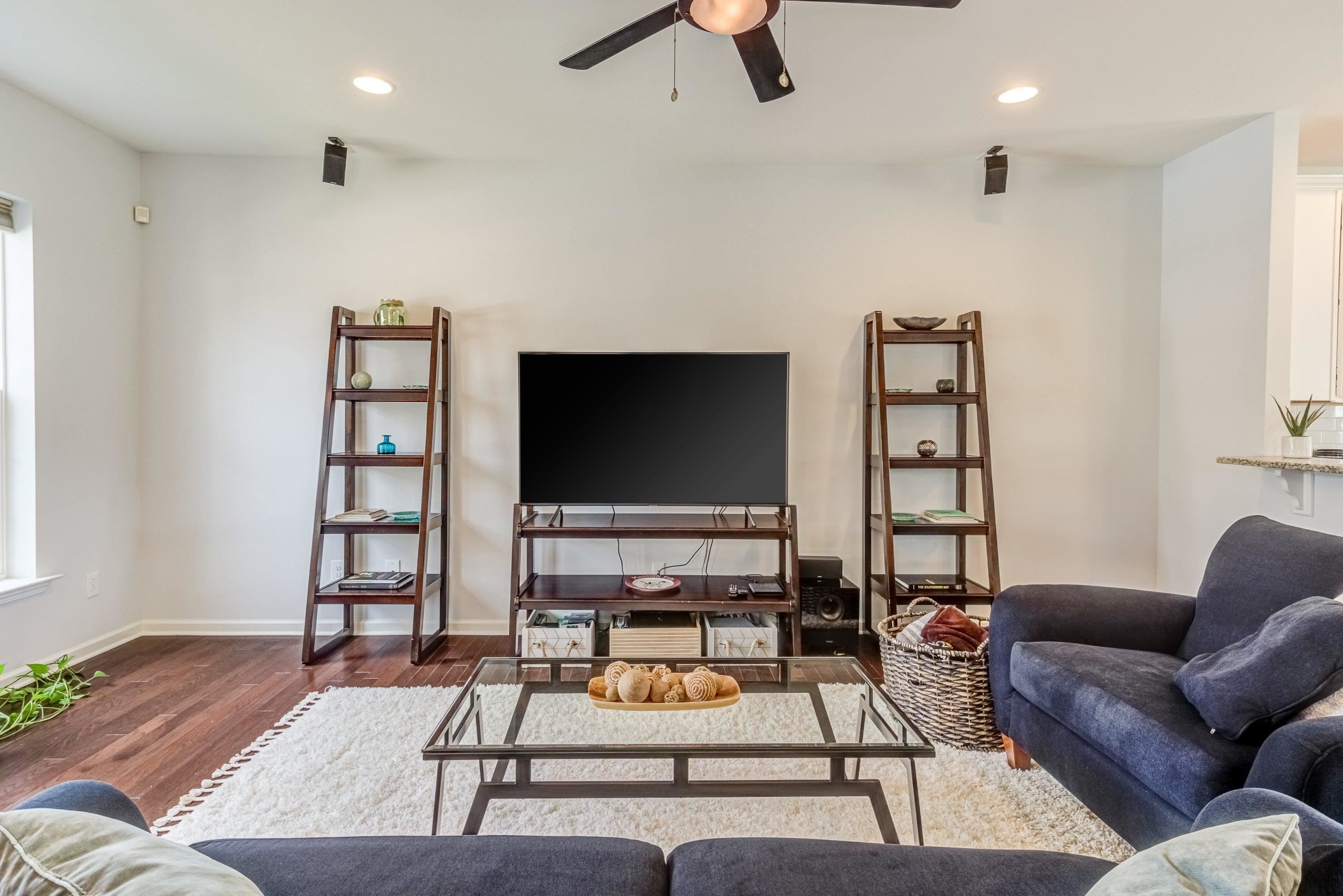 411 Provincial Street Raleigh, NC 27603 - Photo 5 of 41 a living room with furniture and a flat screen tv