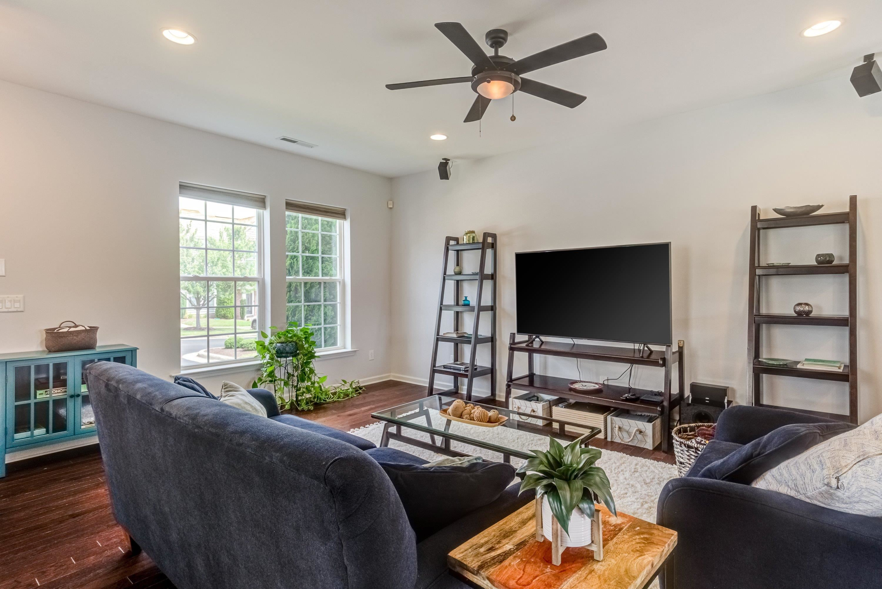411 Provincial Street Raleigh, NC 27603 - Photo 7 of 41 a living room with furniture and a flat screen tv