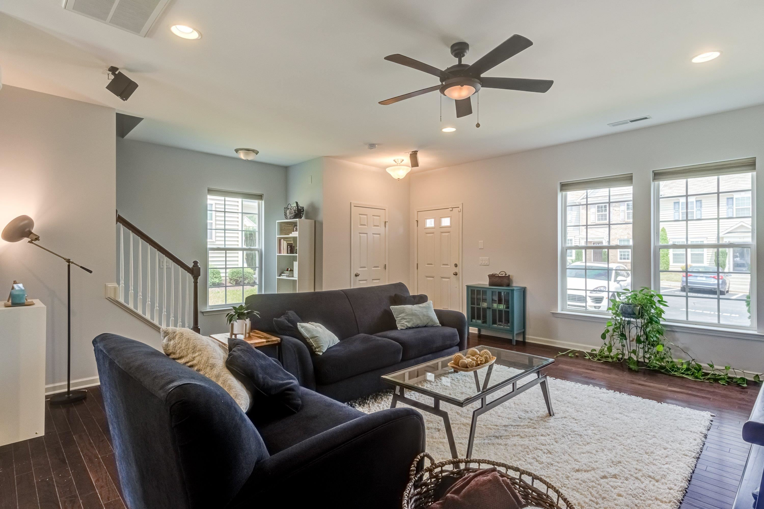 411 Provincial Street Raleigh, NC 27603 - Photo 8 of 41 a living room with furniture ceiling fan and a window
