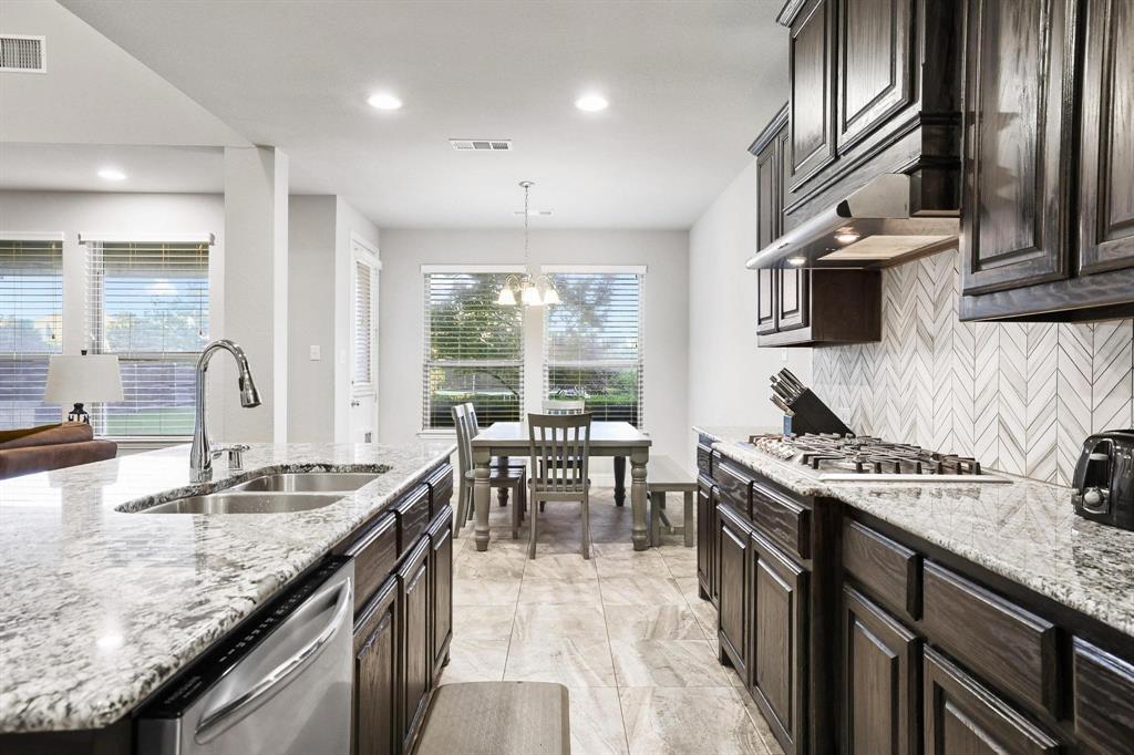 3500 Jersey Road Melissa, TX 75454 - Photo 10 of 40 a kitchen with granite countertop lots of counter top space and stainless steel appliances