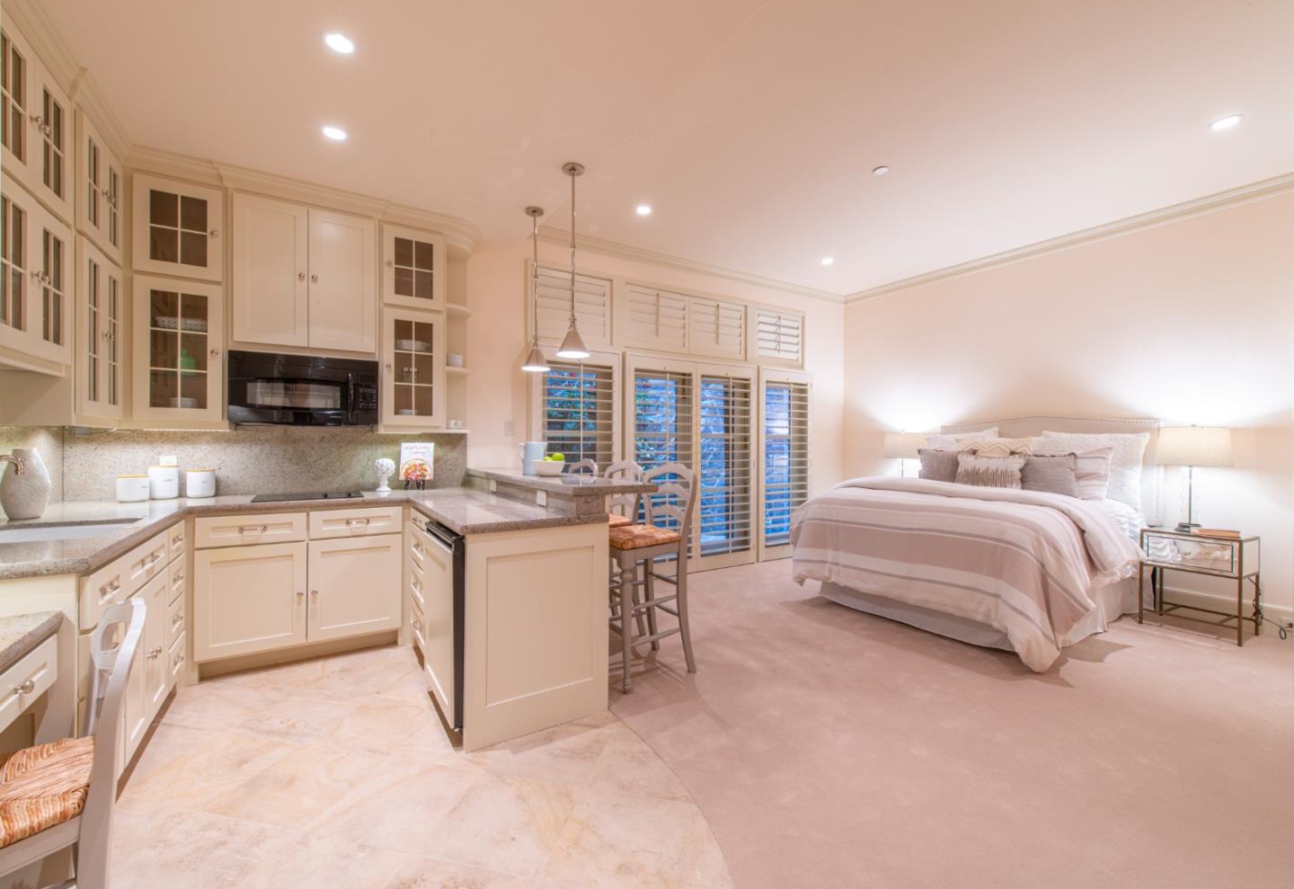 35 Ralston Road Atherton, CA 94027 - Photo 21 of 34 a spacious bedroom with a large bed and a couch