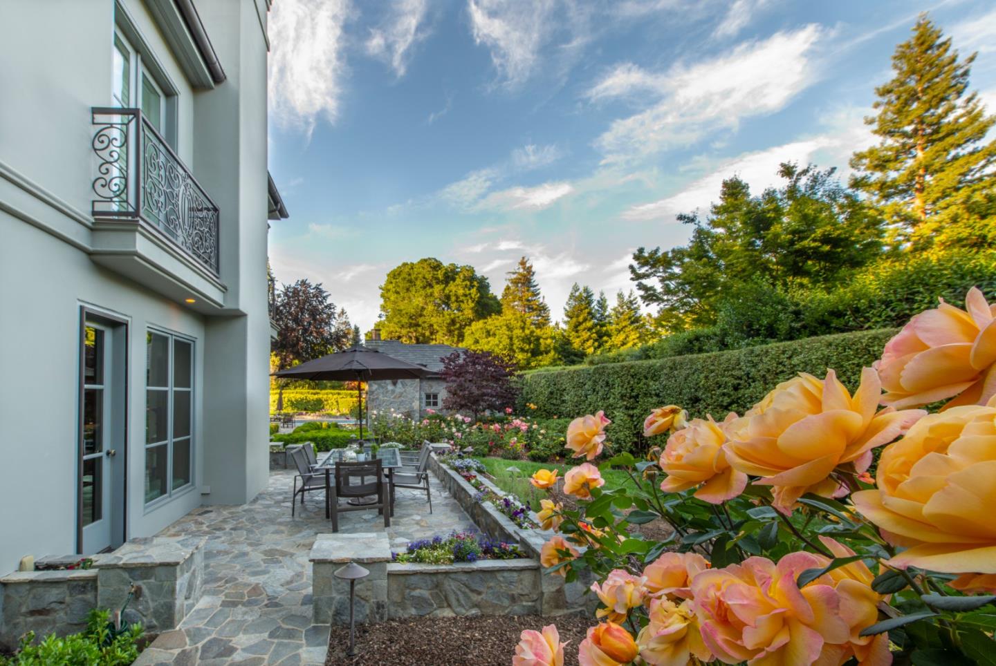 35 Ralston Road Atherton, CA 94027 - Photo 31 of 34 a view of a swimming pool with lawn chairs and plants