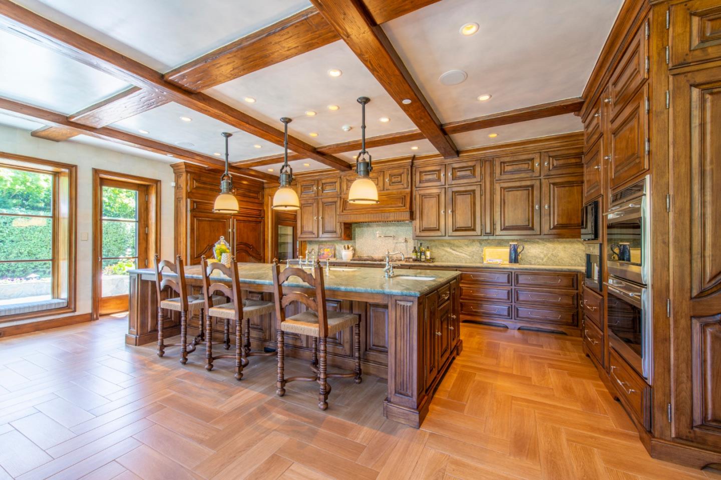 35 Ralston Road Atherton, CA 94027 - Photo 10 of 34 a kitchen with lots of wooden cabinets a sink and appliances