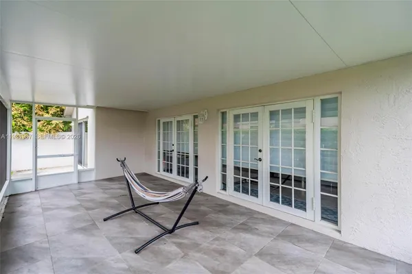 a living room with furniture and windows