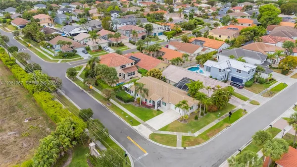 an aerial view of a house with a lake view