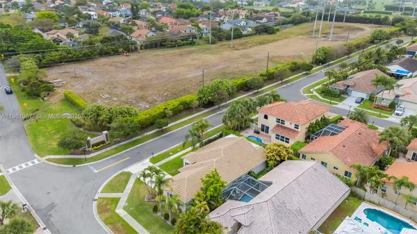 an aerial view of a house with outdoor space lake view and boat