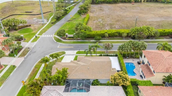 an aerial view of a house with a lake view