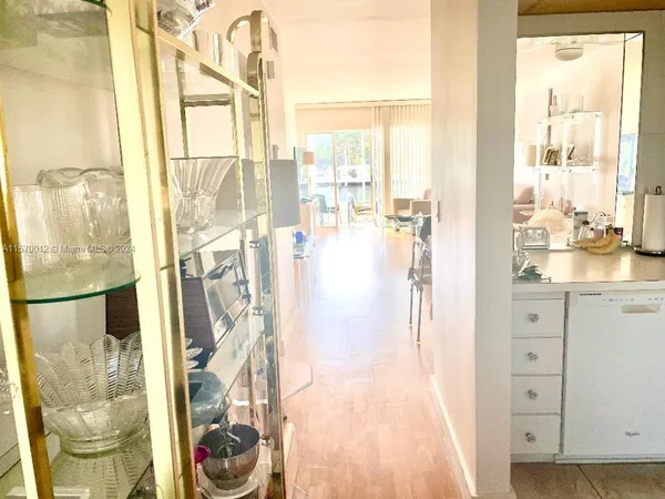 a view of a walk in closet and bathroom