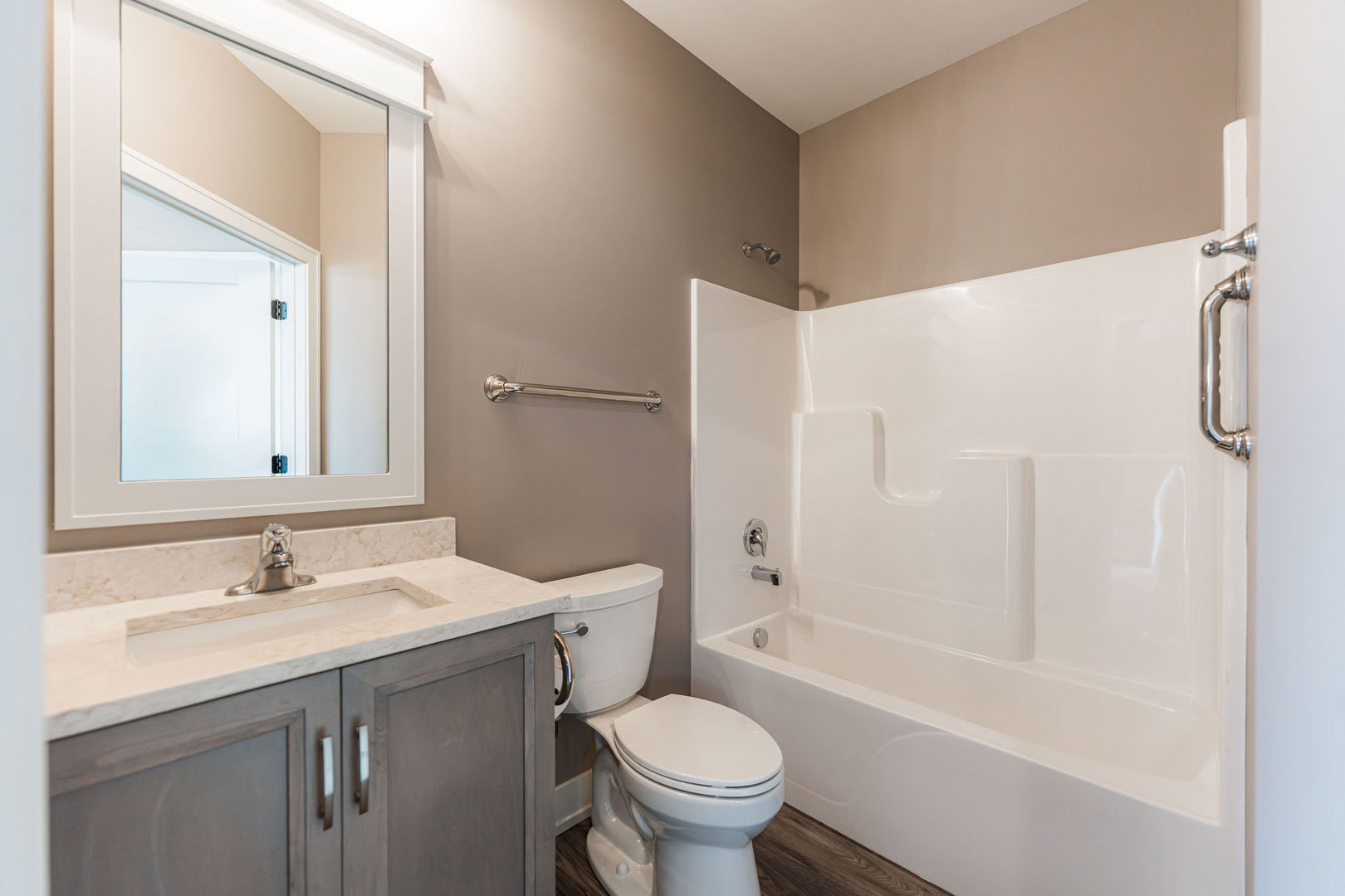 563 Stearn Drive, Unit 563 Genoa, IL 60135 - Photo 12 of 50 a bathroom with a sink toilet and shower