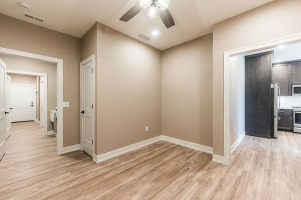 a view of a livingroom with wooden floor