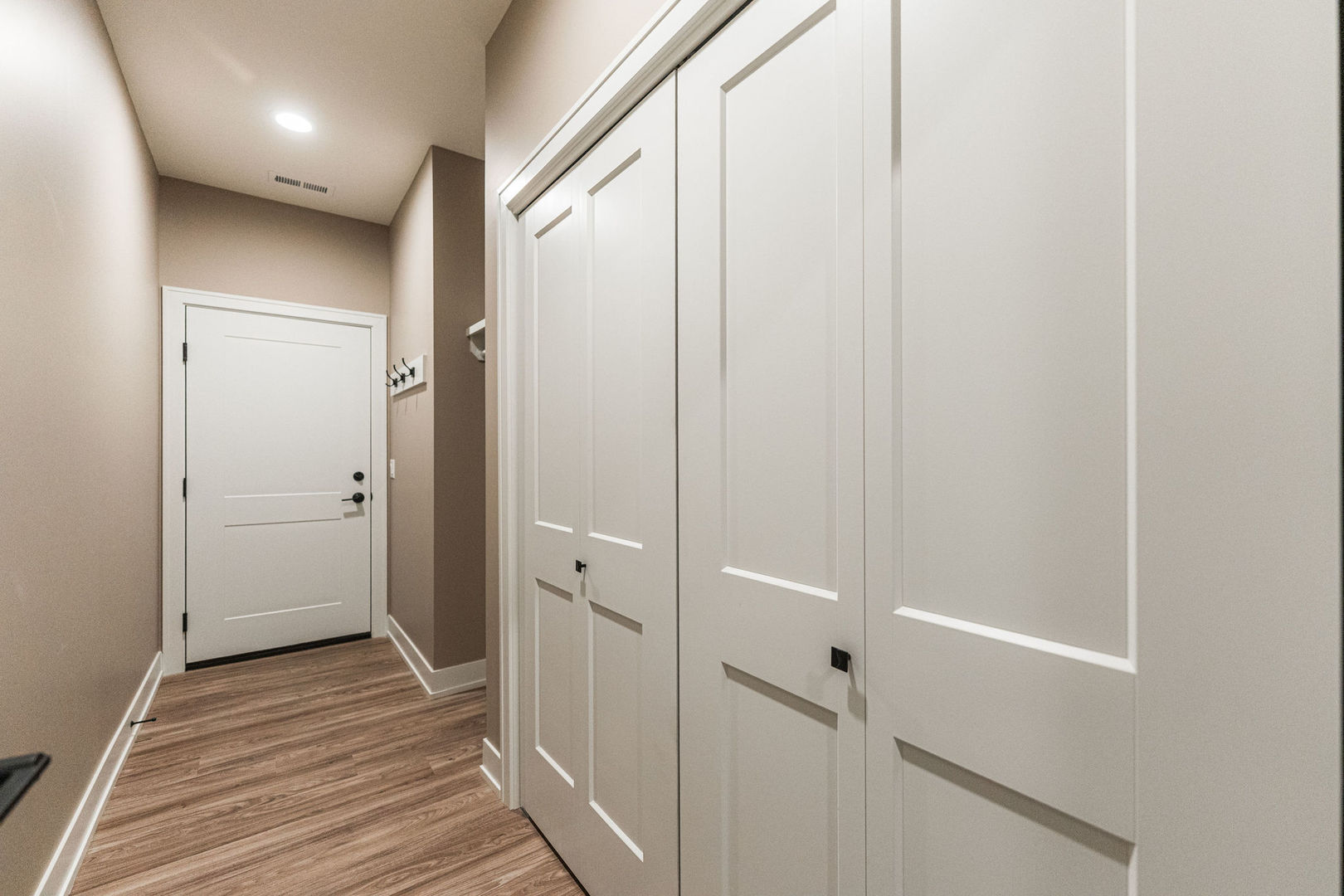 563 Stearn Drive, Unit 563 Genoa, IL 60135 - Photo 23 of 50 a view of a hallway with wooden floor