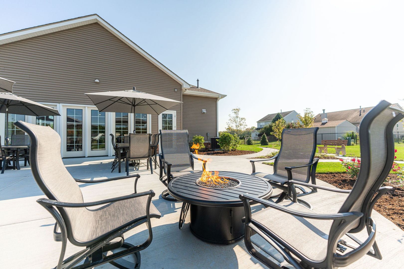 563 Stearn Drive, Unit 563 Genoa, IL 60135 - Photo 50 of 50 a view of a patio with table and chairs and potted plants