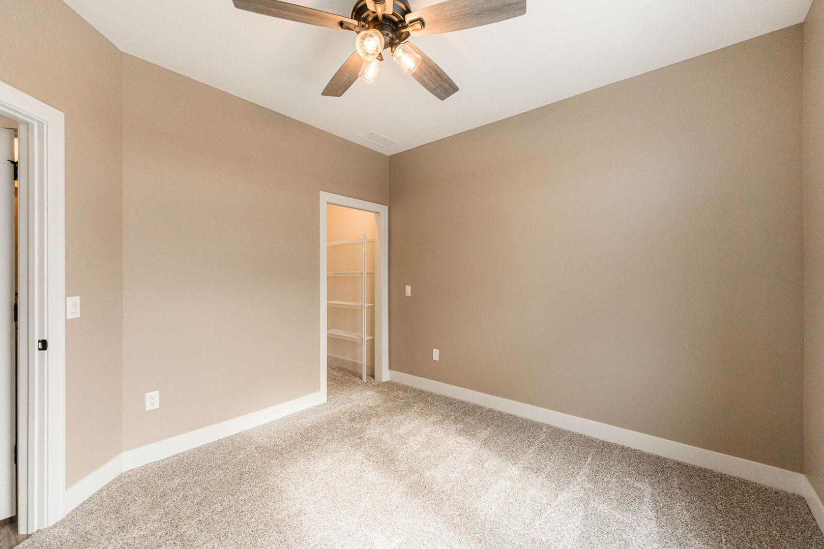 563 Stearn Drive, Unit 563 Genoa, IL 60135 - Photo 10 of 50 a view of an empty room and chandelier fan