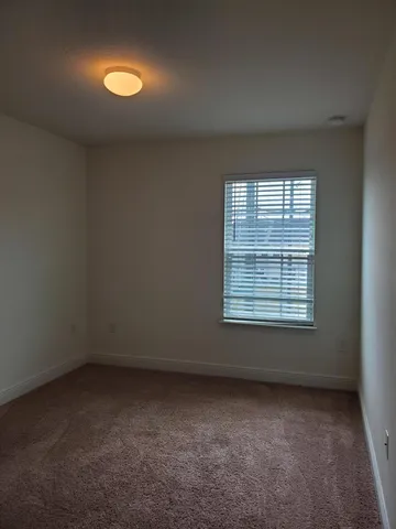 an empty room with a empty space and a window