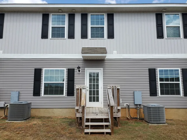a front view of a house with a large window