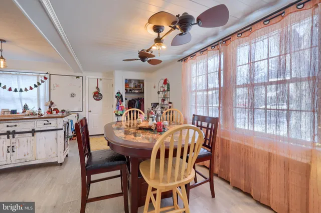 a view of a dining room with furniture and window
