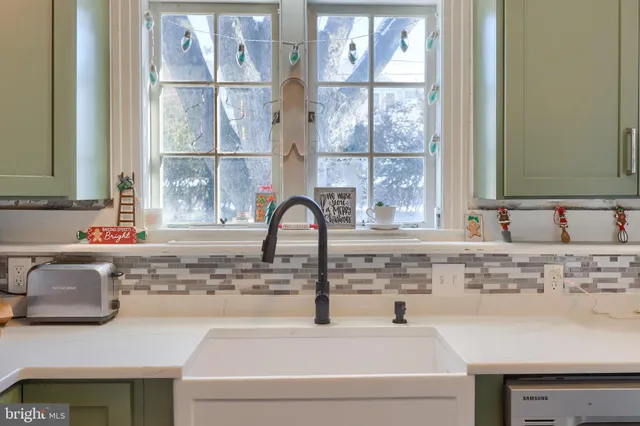 a bathroom with a sink and a window