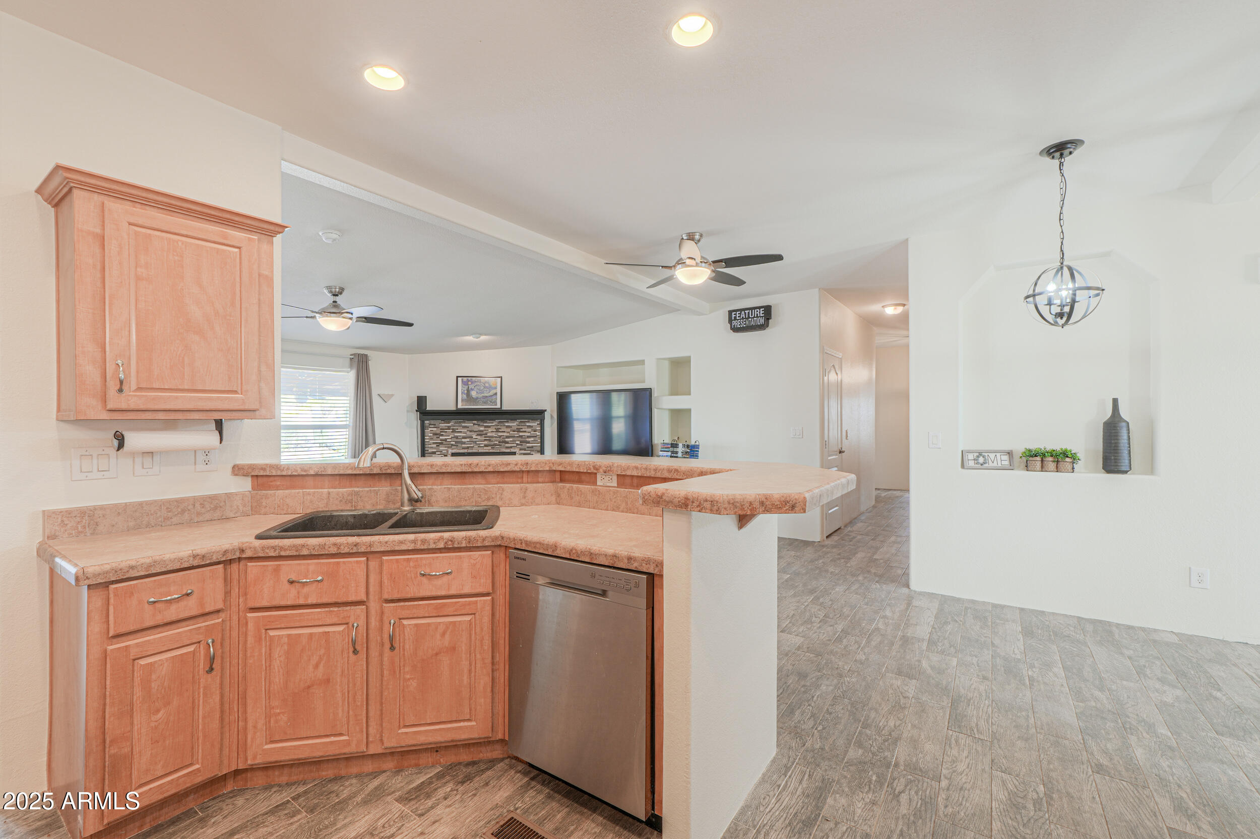 176 North Acacia Road Apache Junction, AZ 85119 - Photo 13 of 65 a kitchen with a sink and cabinets