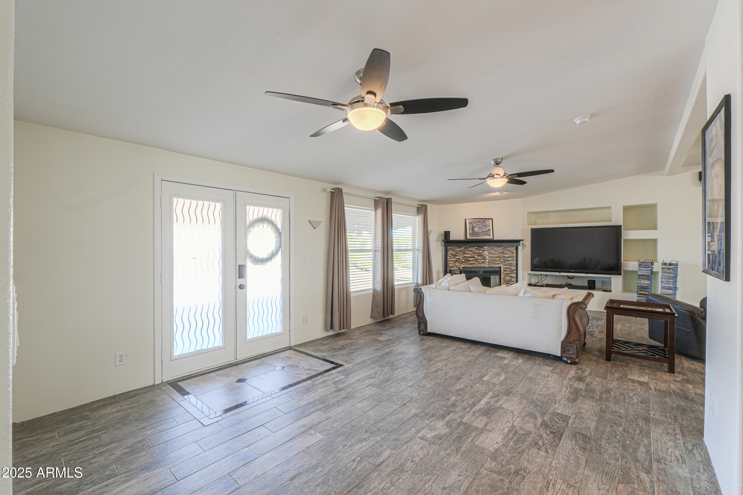 176 North Acacia Road Apache Junction, AZ 85119 - Photo 15 of 65 a living room with furniture and a flat screen tv