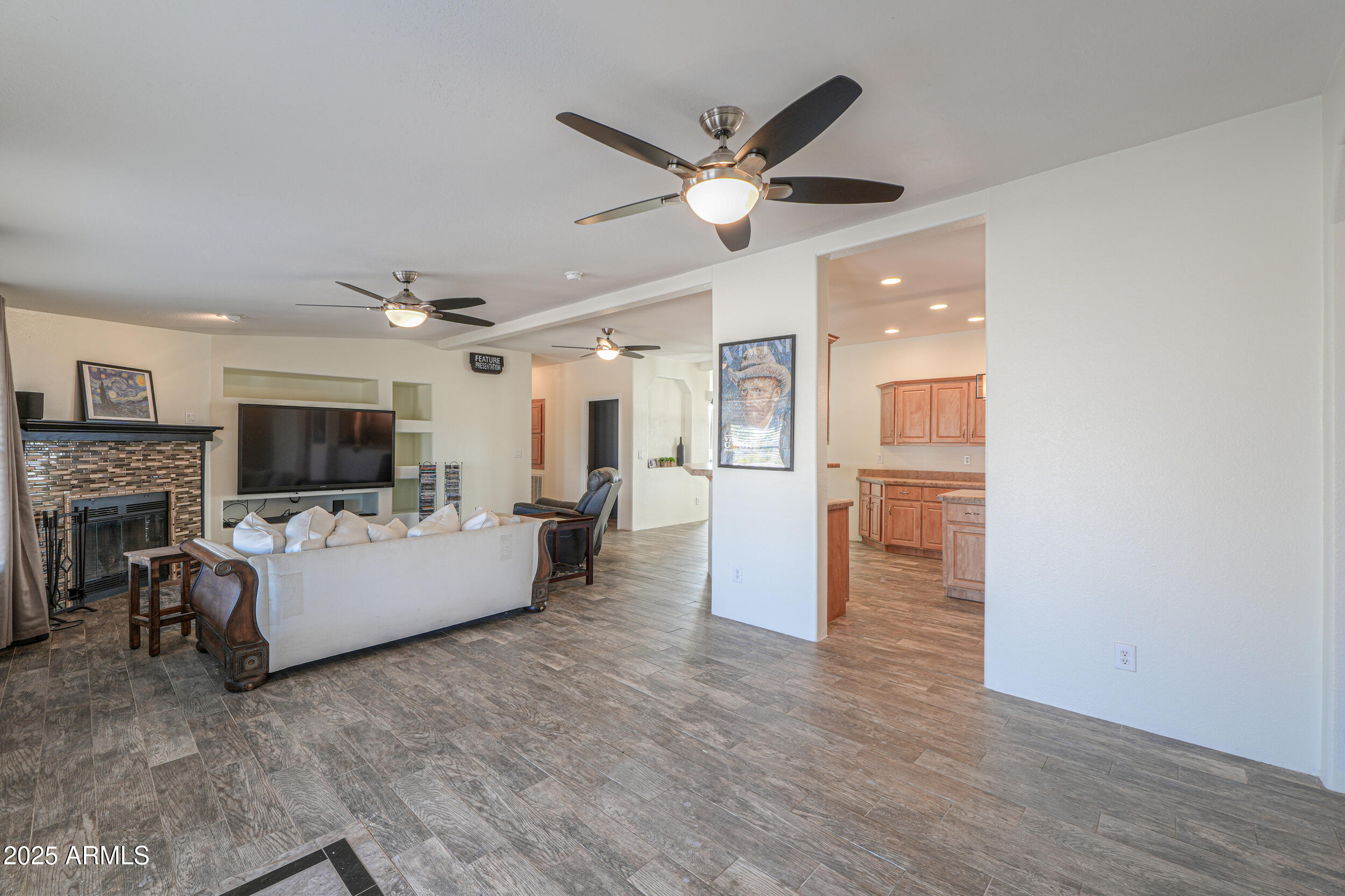 176 North Acacia Road Apache Junction, AZ 85119 - Photo 16 of 65 a living room with furniture wooden floor and a fireplace