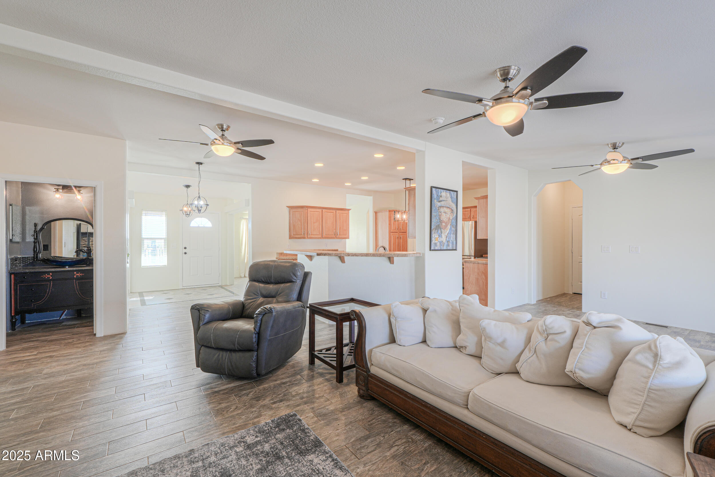 176 North Acacia Road Apache Junction, AZ 85119 - Photo 18 of 65 a living room with furniture and a ceiling fan