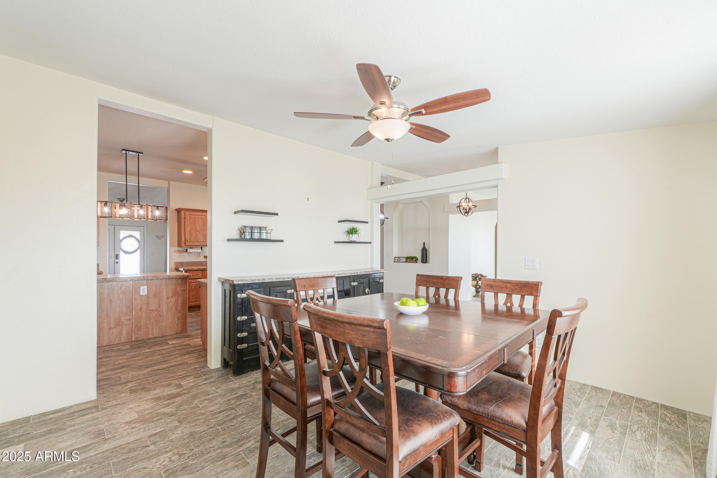 176 North Acacia Road Apache Junction, AZ 85119 - Photo 21 of 65 a view of a dining room with furniture and wooden floor