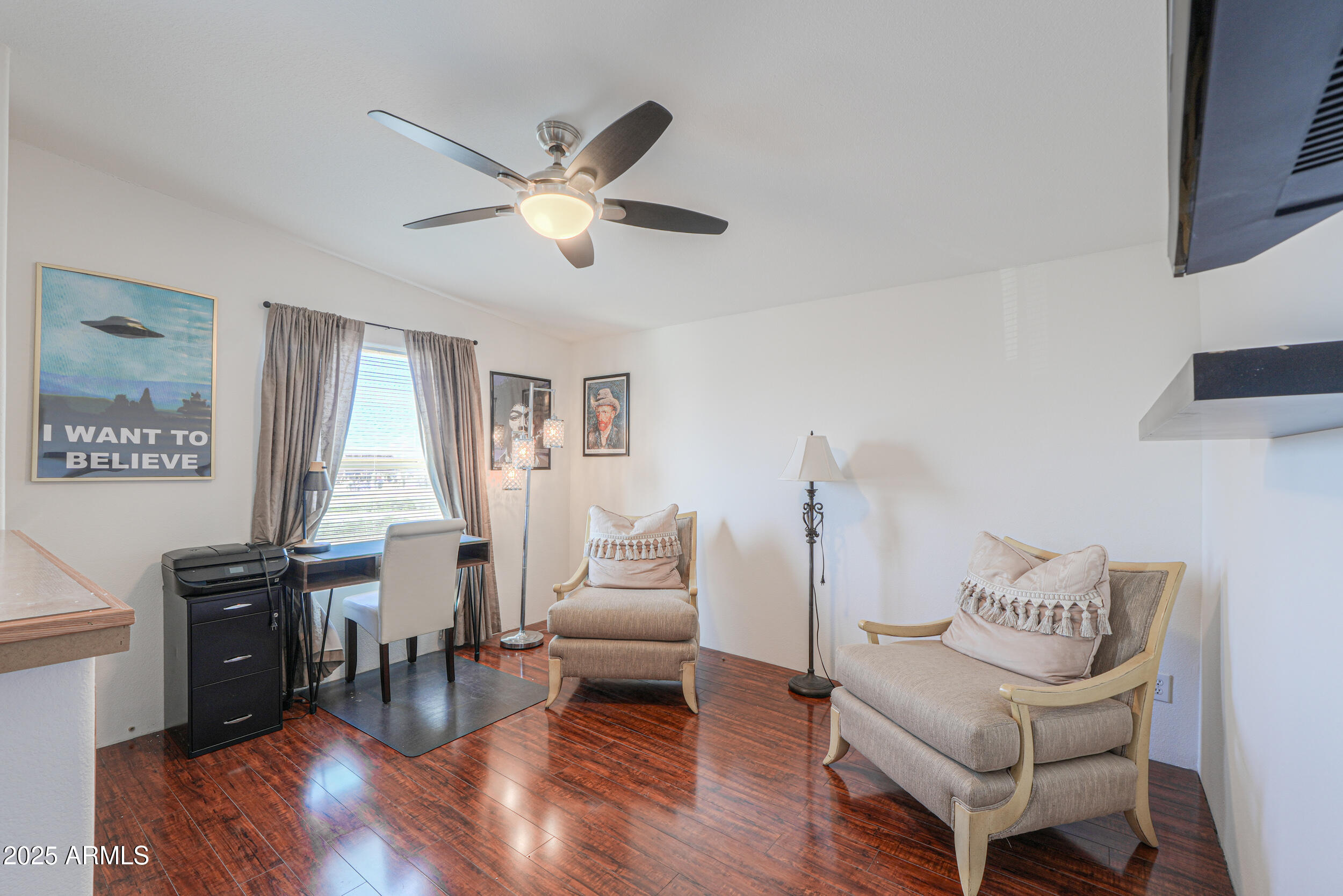 176 North Acacia Road Apache Junction, AZ 85119 - Photo 25 of 65 a living room with furniture and a large window