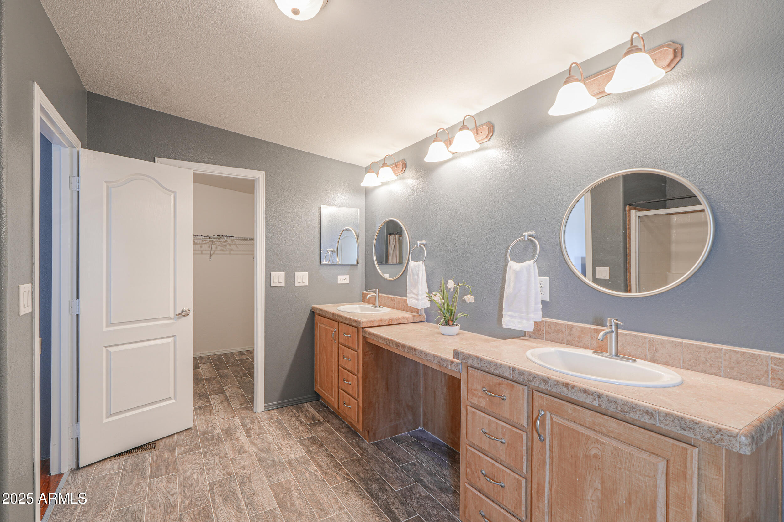 176 North Acacia Road Apache Junction, AZ 85119 - Photo 29 of 65 a bathroom with a double vanity sink and a mirror