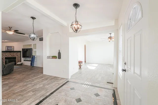 a bathroom with a granite countertop double vanity sink a mirror and a toilet