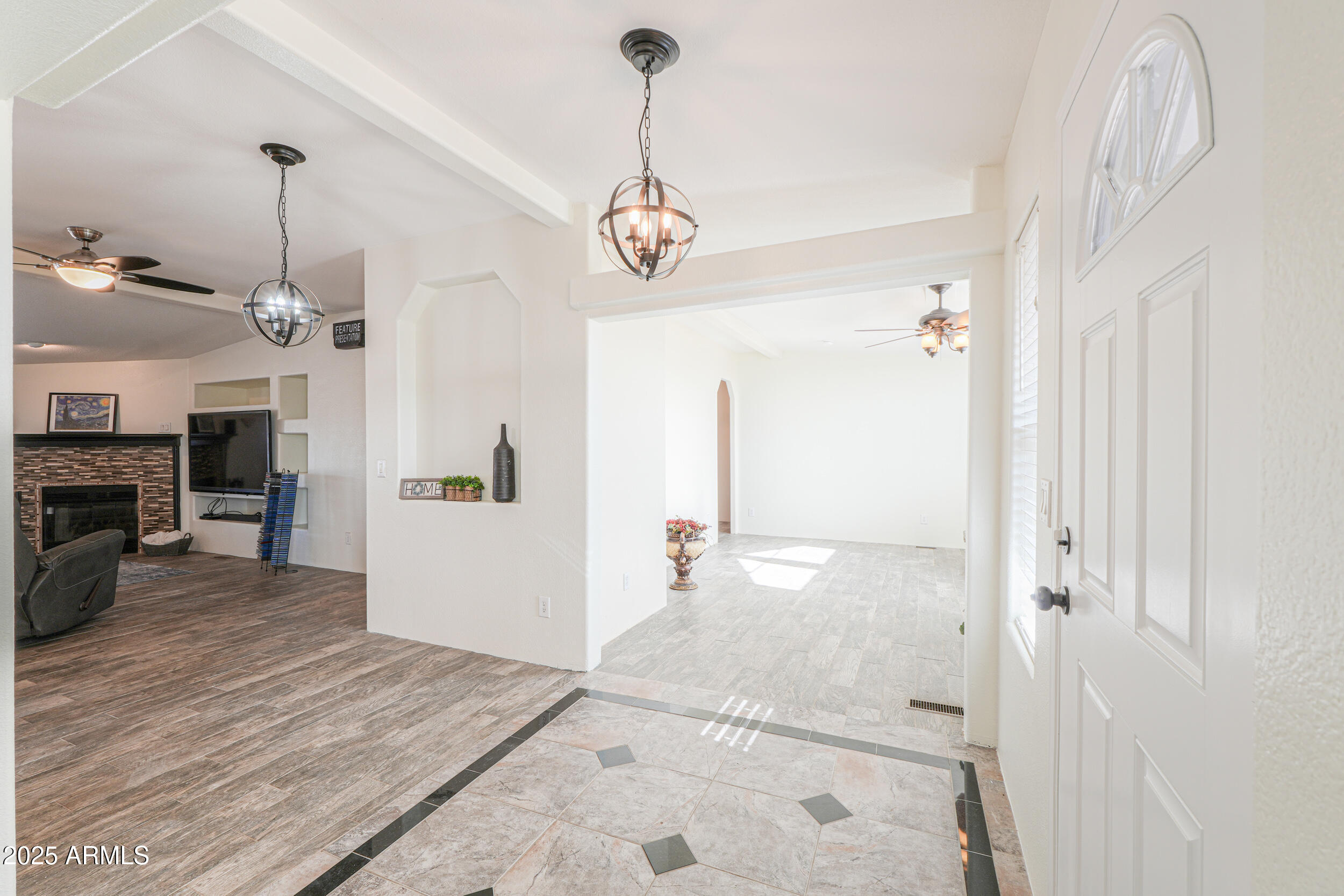 176 North Acacia Road Apache Junction, AZ 85119 - Photo 31 of 65 a view of a hallway with wooden floor and a kitchen