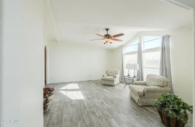a view of a bathroom with a shower and a window