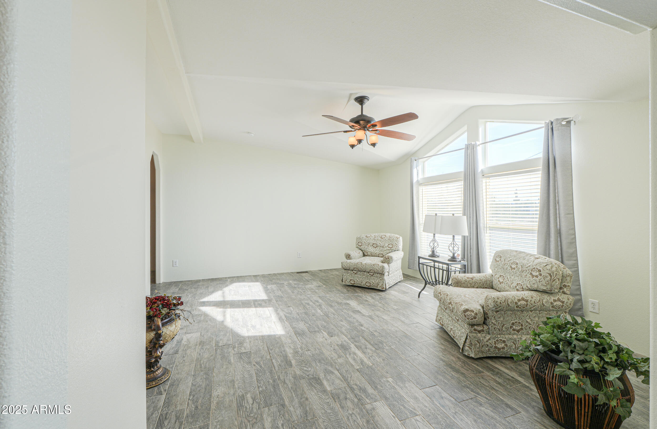 176 North Acacia Road Apache Junction, AZ 85119 - Photo 32 of 65 a living room with furniture and wooden floor