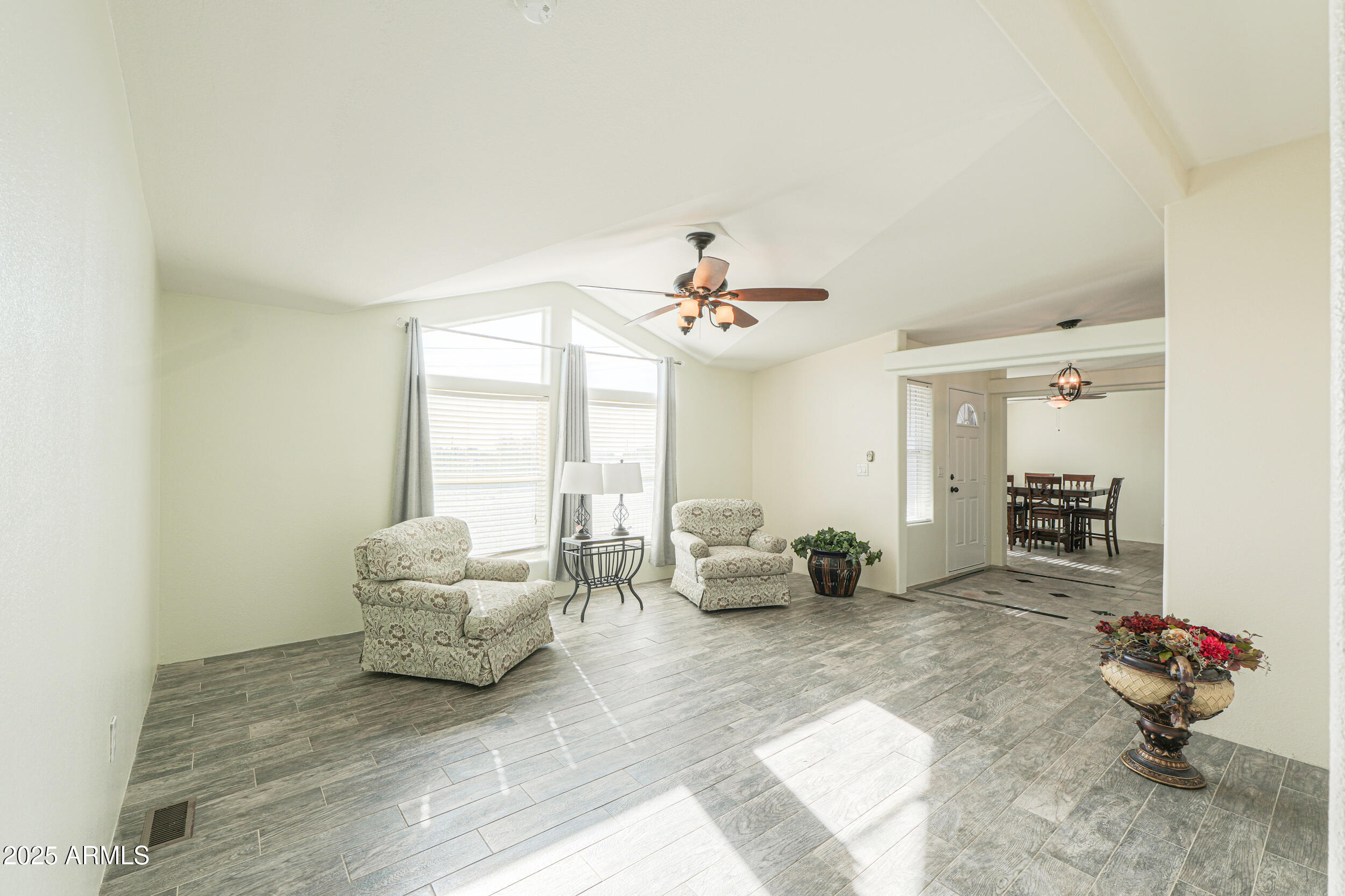 176 North Acacia Road Apache Junction, AZ 85119 - Photo 33 of 65 a living room with furniture and a large window