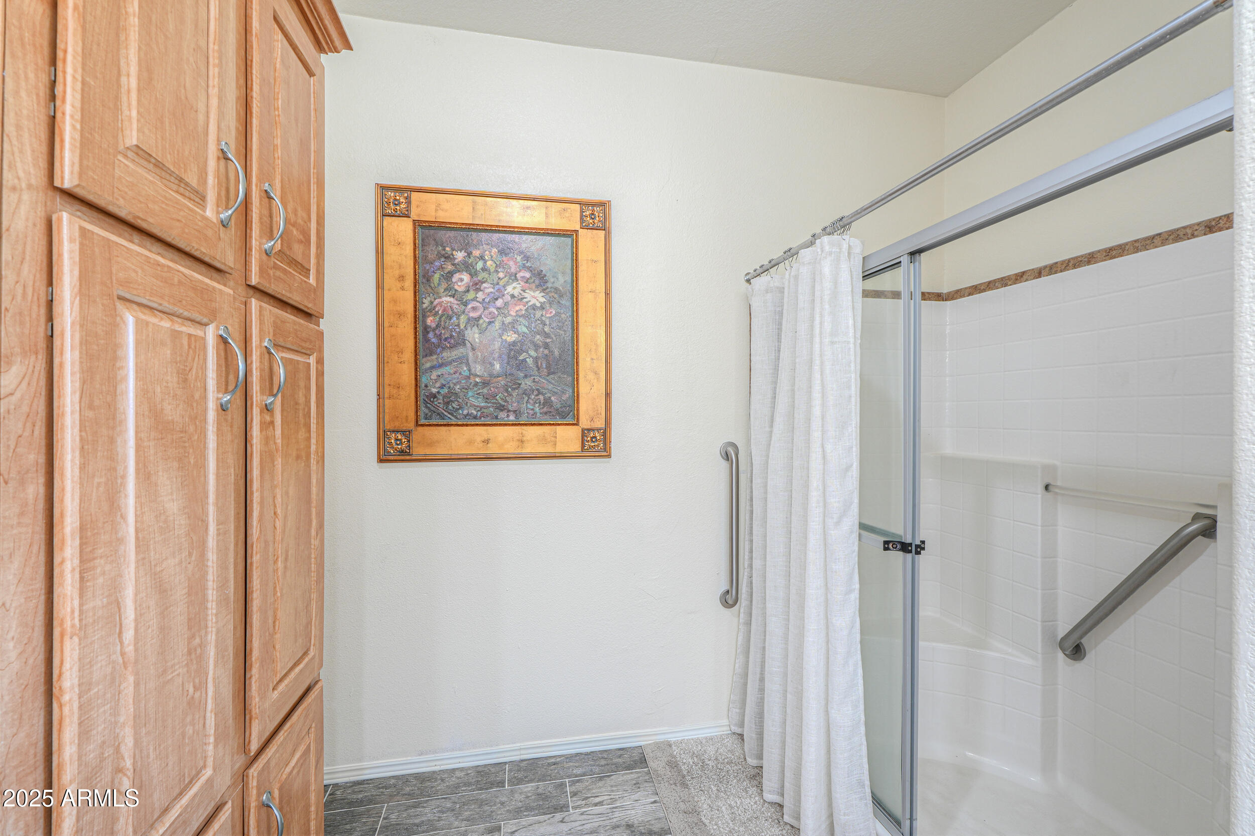 176 North Acacia Road Apache Junction, AZ 85119 - Photo 41 of 65 a view of a bathroom with a shower and a window