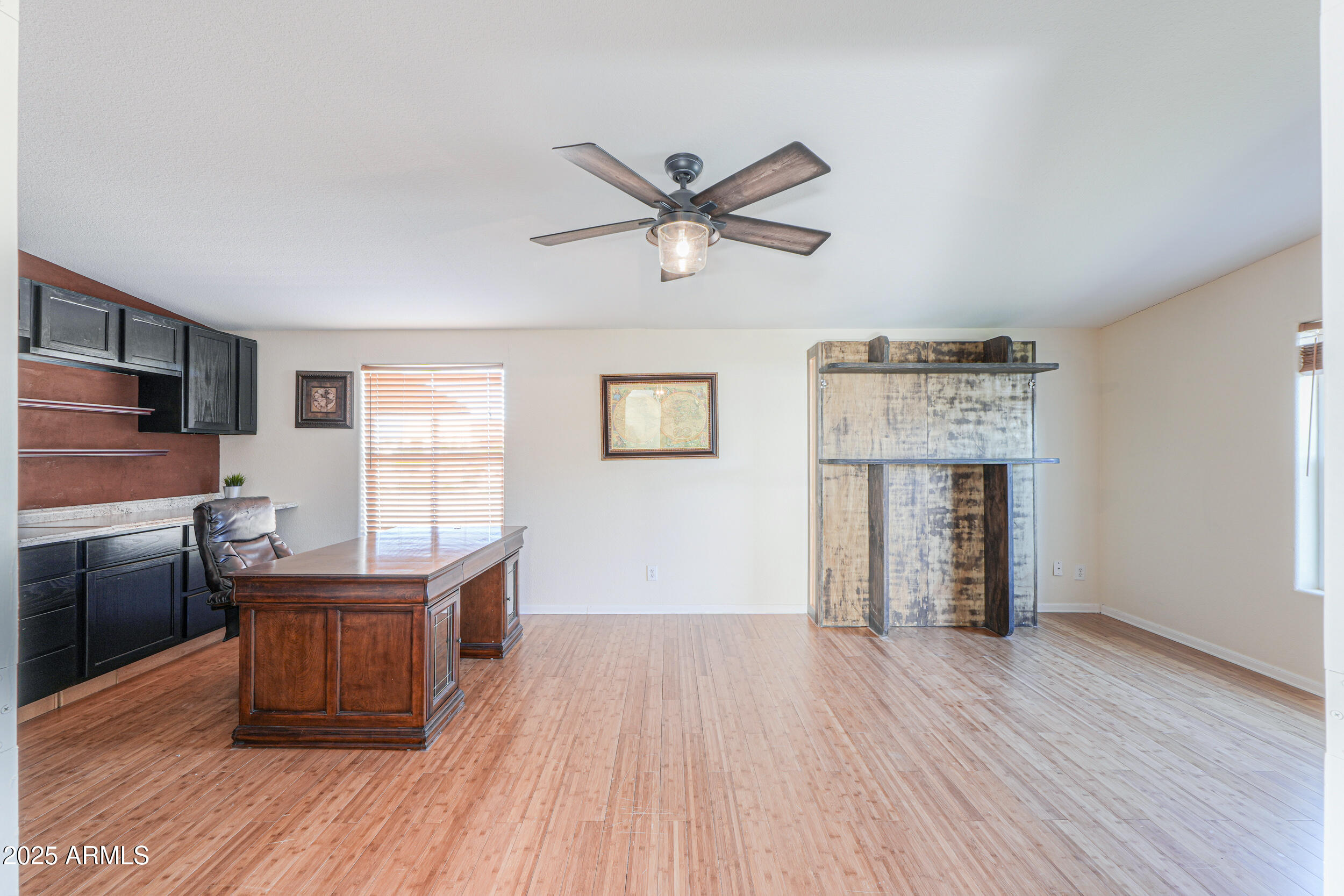 176 North Acacia Road Apache Junction, AZ 85119 - Photo 43 of 65 a workspace with wooden floor and a window