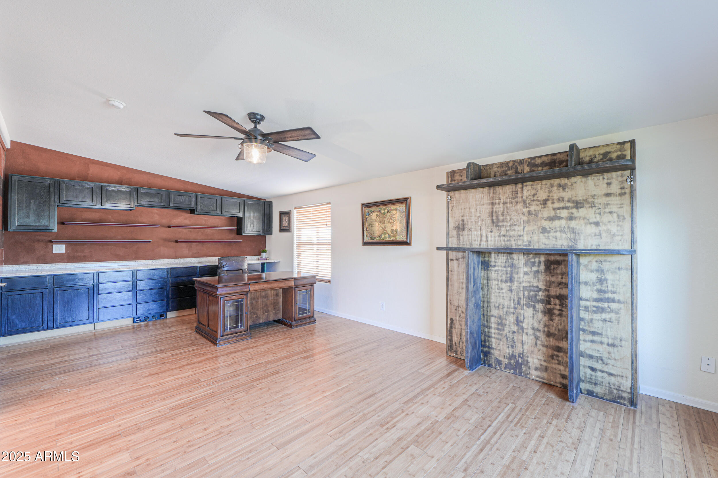 176 North Acacia Road Apache Junction, AZ 85119 - Photo 44 of 65 a living room with furniture and a wooden floor