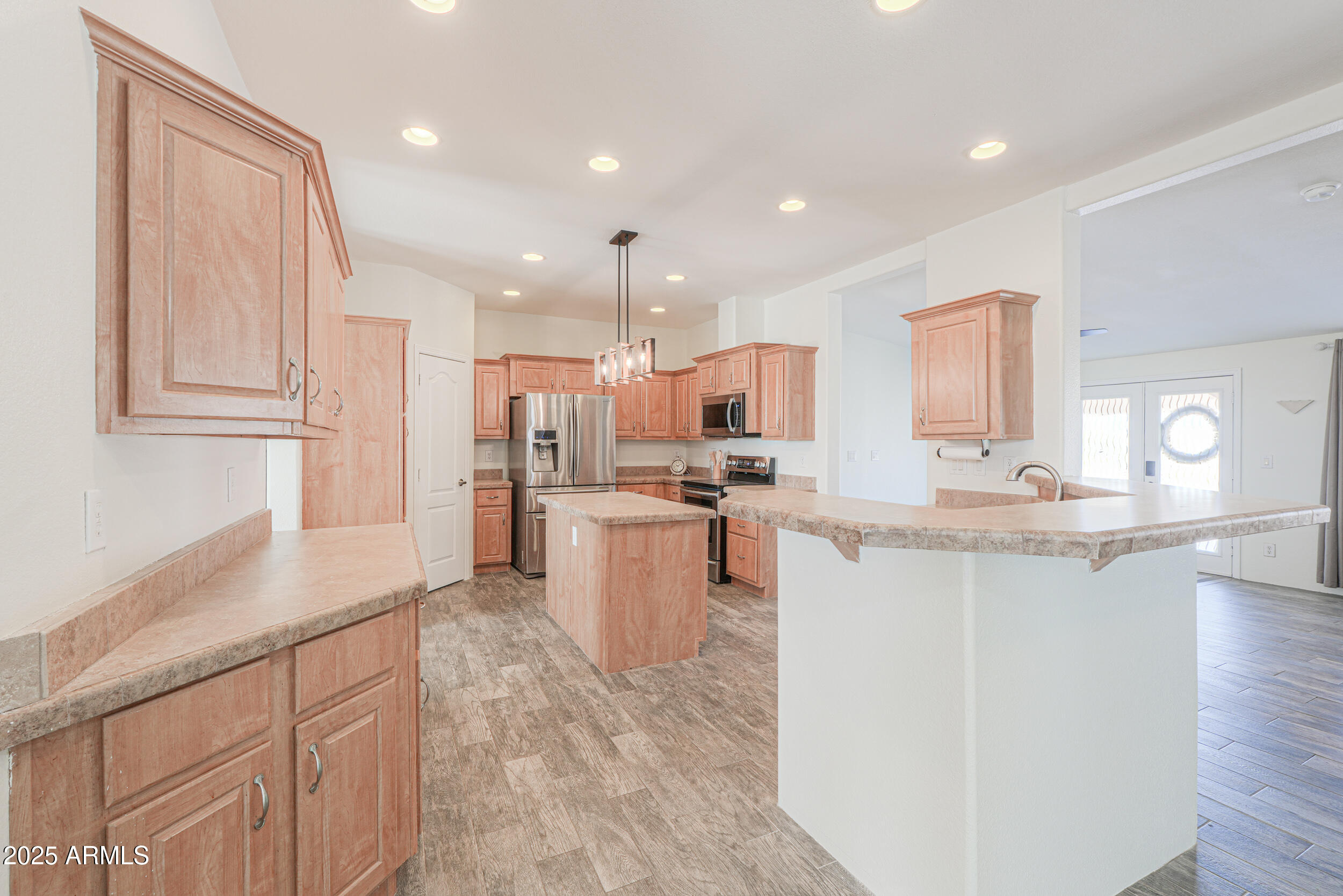 176 North Acacia Road Apache Junction, AZ 85119 - Photo 7 of 65 a kitchen with a sink microwave and refrigerator