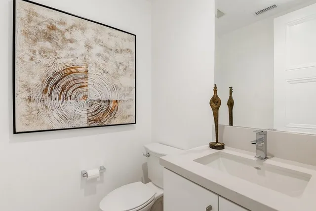 a bedroom with a large bed and a balcony view