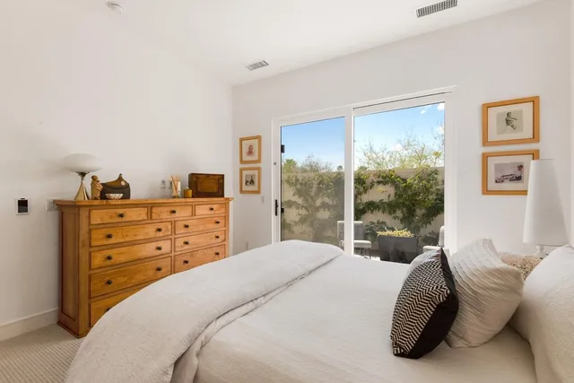 a patio with table and chairs