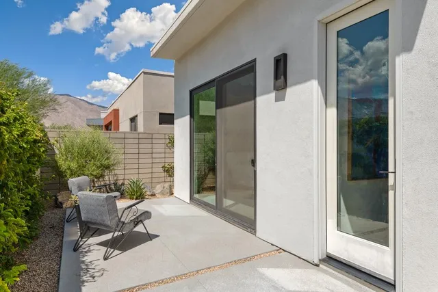 a bedroom with a bed and a television
