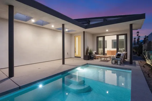 a lobby with furniture and a potted plant