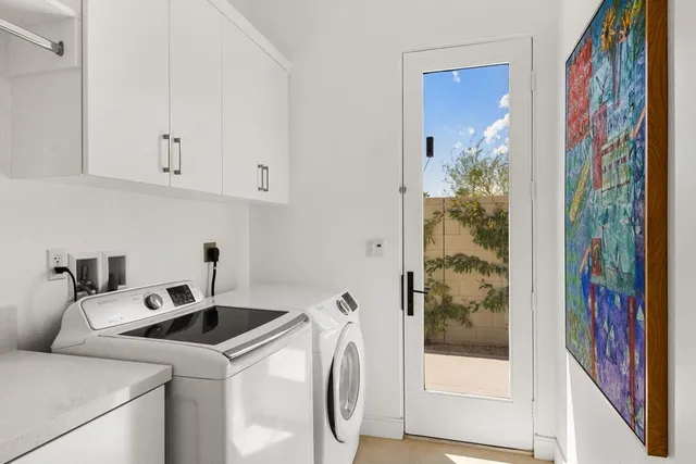 a view of a patio with couches and pool
