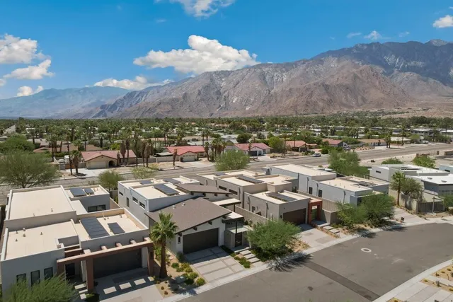 a view of a backyard with sitting area