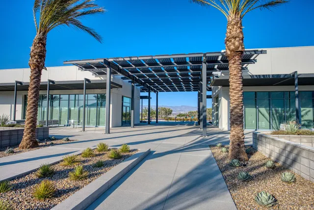 a view of a swimming pool with a table and chairs