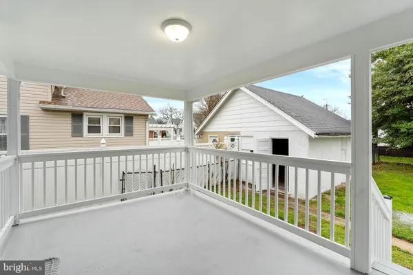 a view of a house with wooden deck